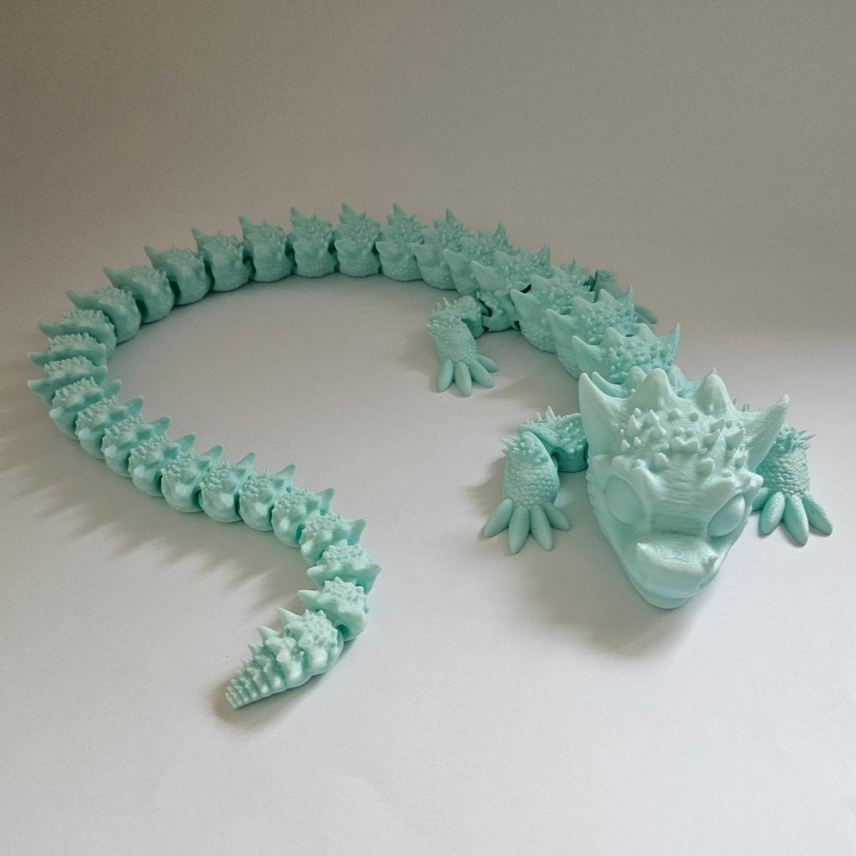 Dragon flexibil și articulat de 1 metru cu gradient albastru