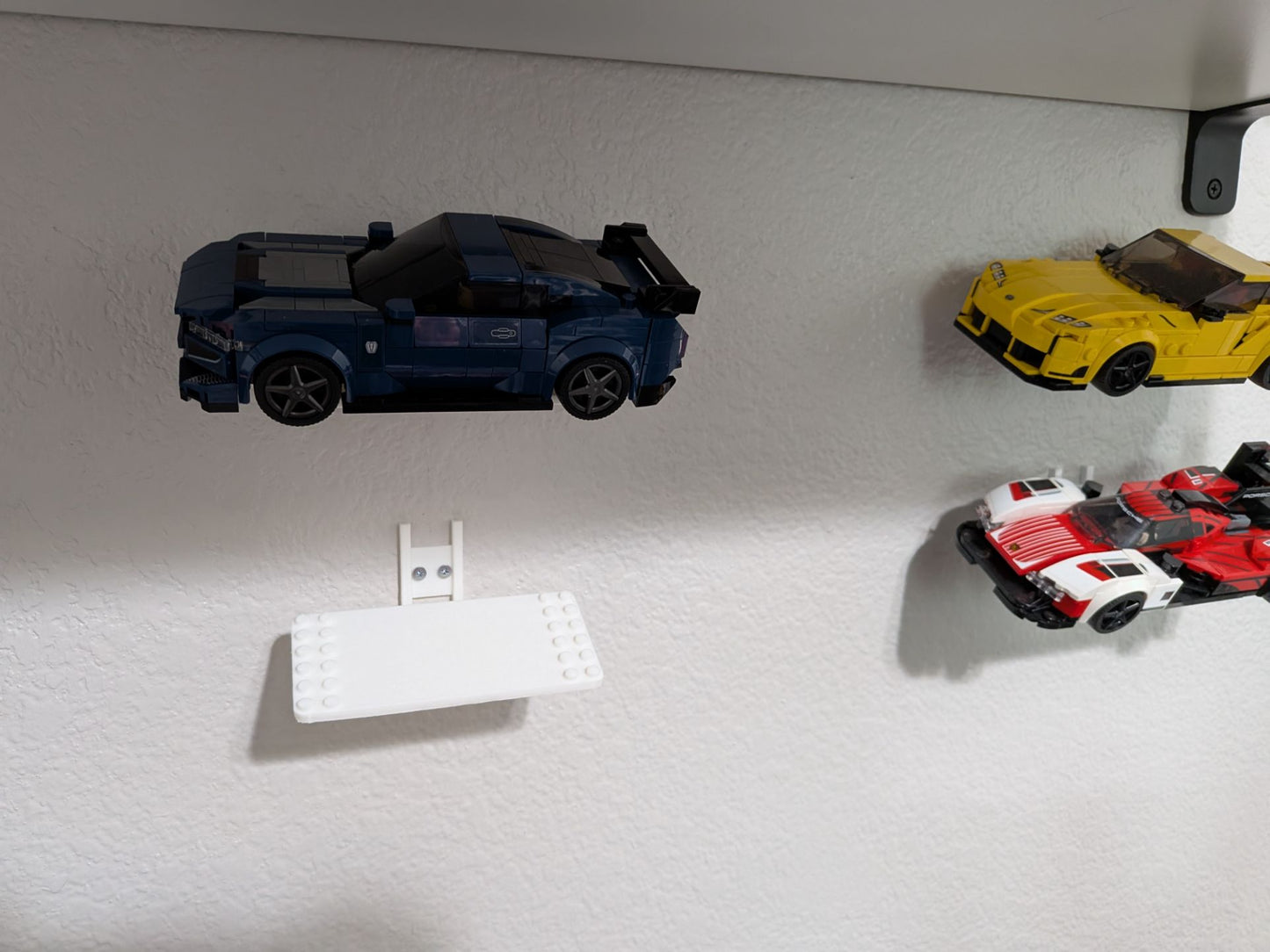 Suport perete pentru mașini LEGO Speed Champions v2, invizibil