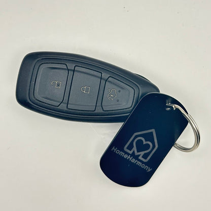 Breloc metalic personalizat, placută identificare neagră, 50 x 30 mm